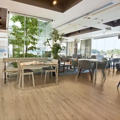 Restaurant with a hazel oak wood-effect porcelain tile floor